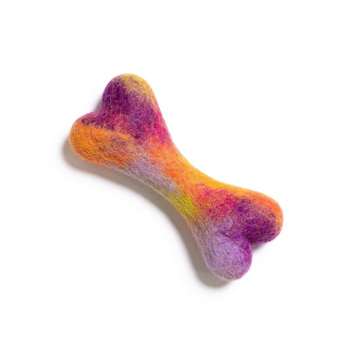Colorful bone-shaped toy on a white background