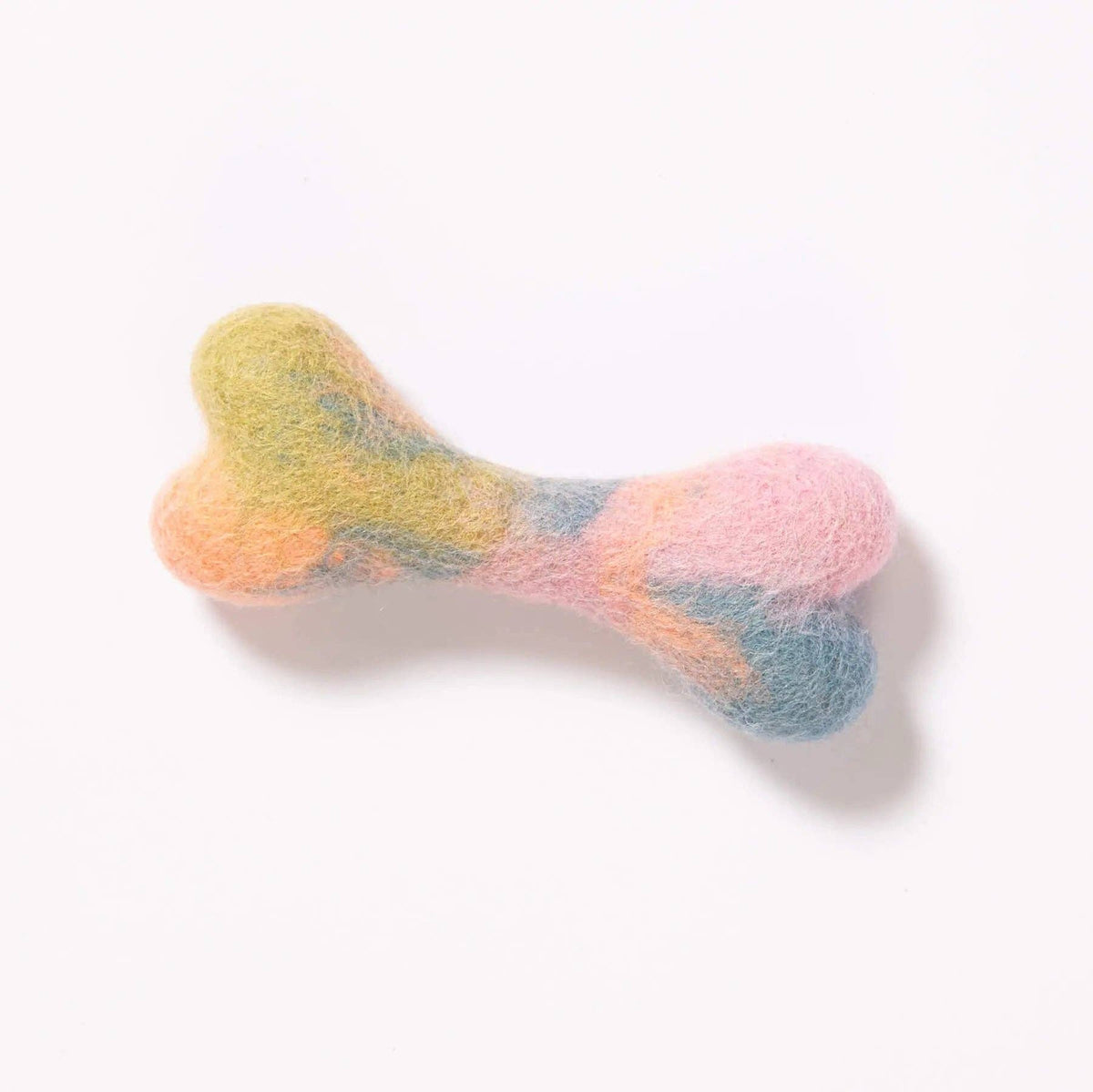 Colorful bone-shaped toy on a white background