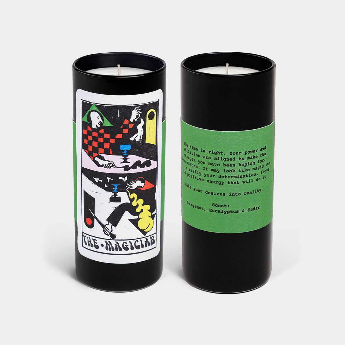 Two candles with tarot card design packaging on a white background