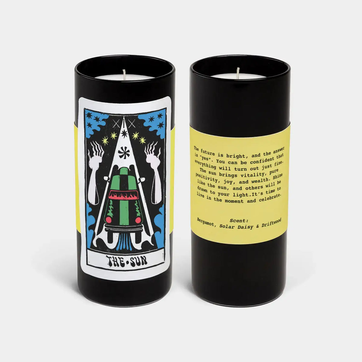 Two candles with tarot card design and text on a white background