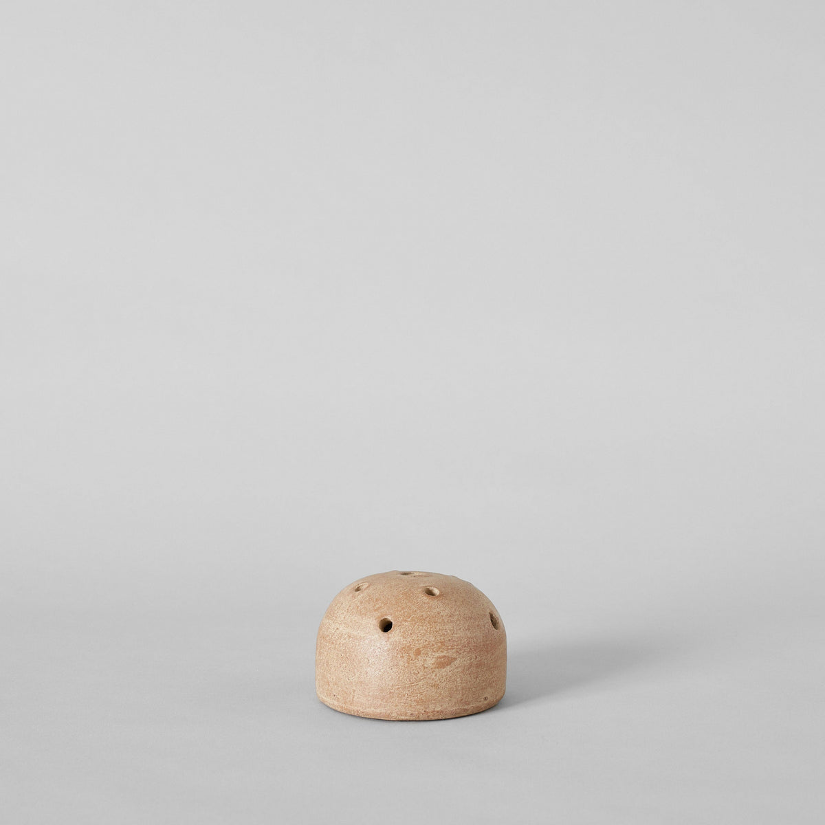Small stone on a light gray background