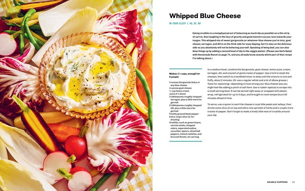 Whipped blue cheese in a bowl surrounded by colorful vegetables on a magazine page.
