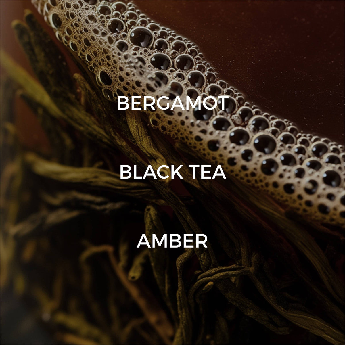 Close-up of a tea leaf with 'Bergamot', 'Black Tea', and 'Amber' text overlay.