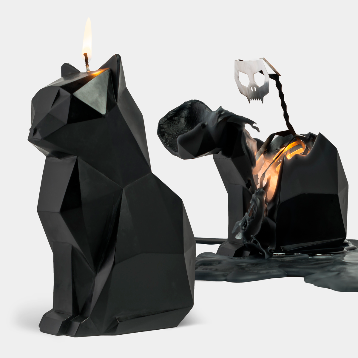 Black geometric cat-shaped candle with a burning design on a white background