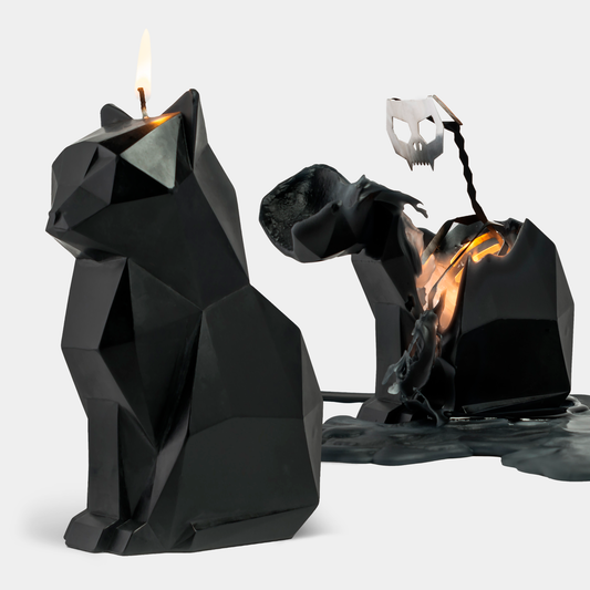 Black geometric cat-shaped candle with a burning design on a white background