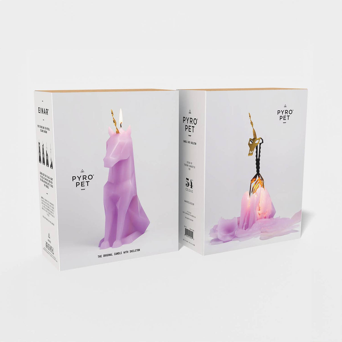 Two boxes of Pyro Pet candles with unicorn and dog designs on a white background