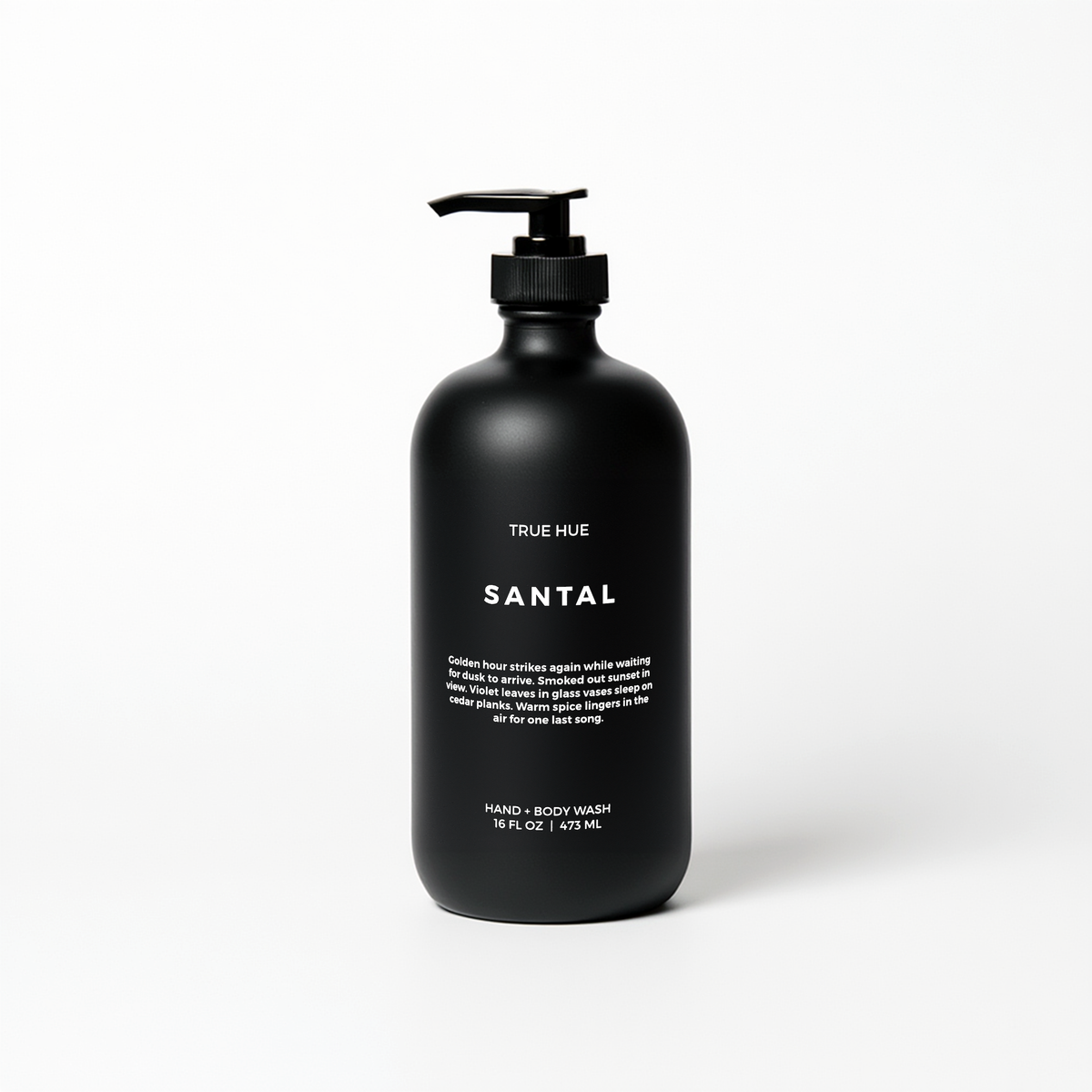 Black bottle of True Hue Bergamot + Black Tea hand and body wash on a white background