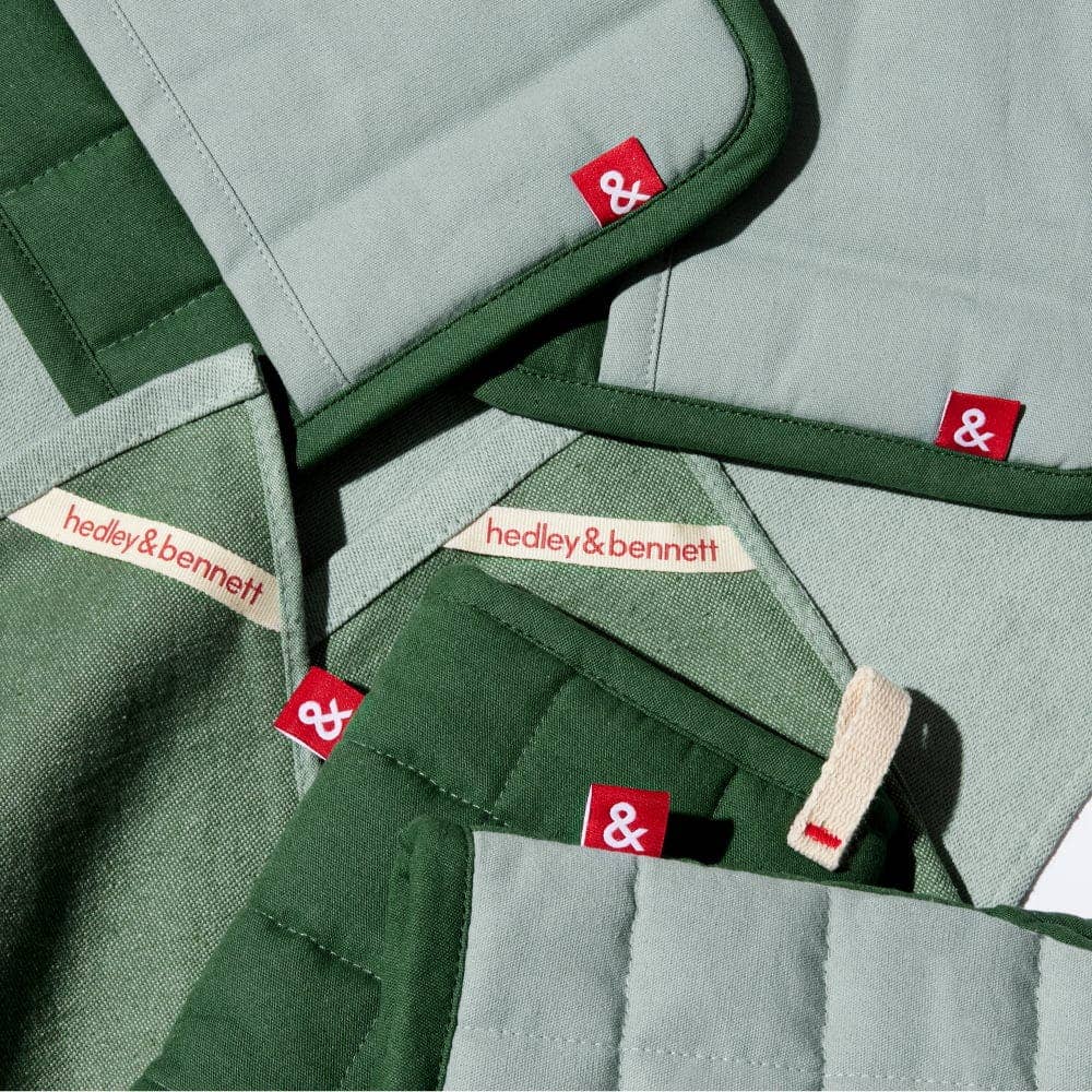 Green fabric with 'hedley & bennett' labels and tags.