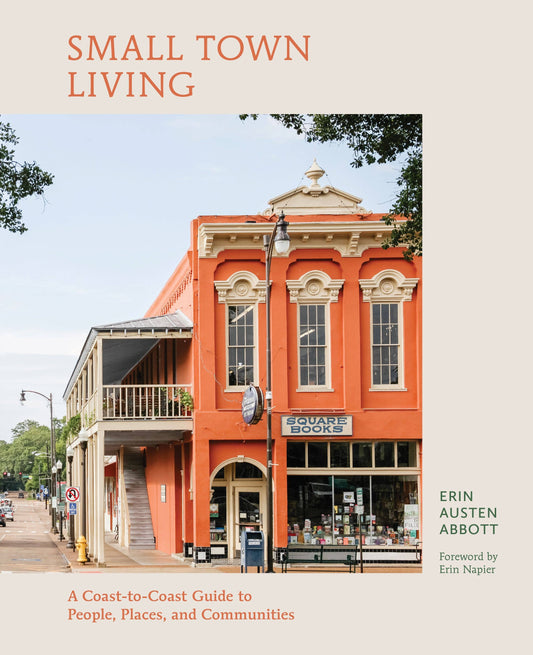 Book cover of 'Small Town Living' with an image of a historic building.