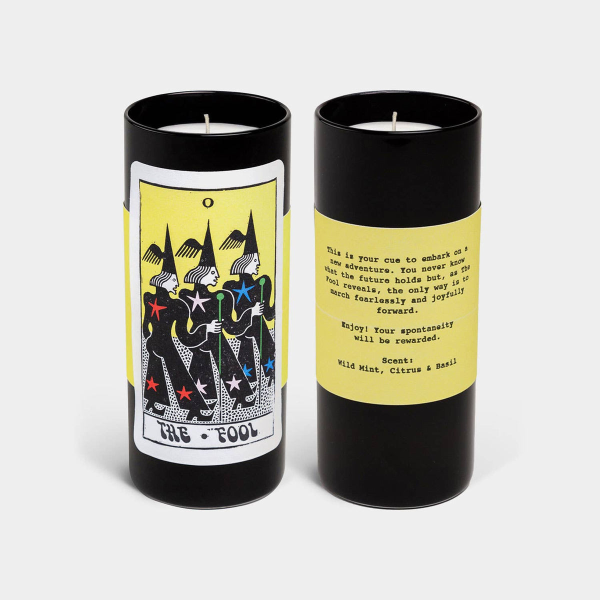 Front and back of a candle with tarot card design and text on a white background