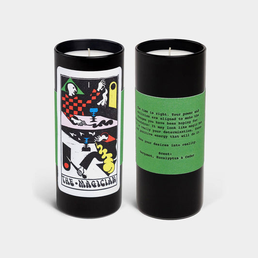 Two candles with tarot card design packaging on a white background