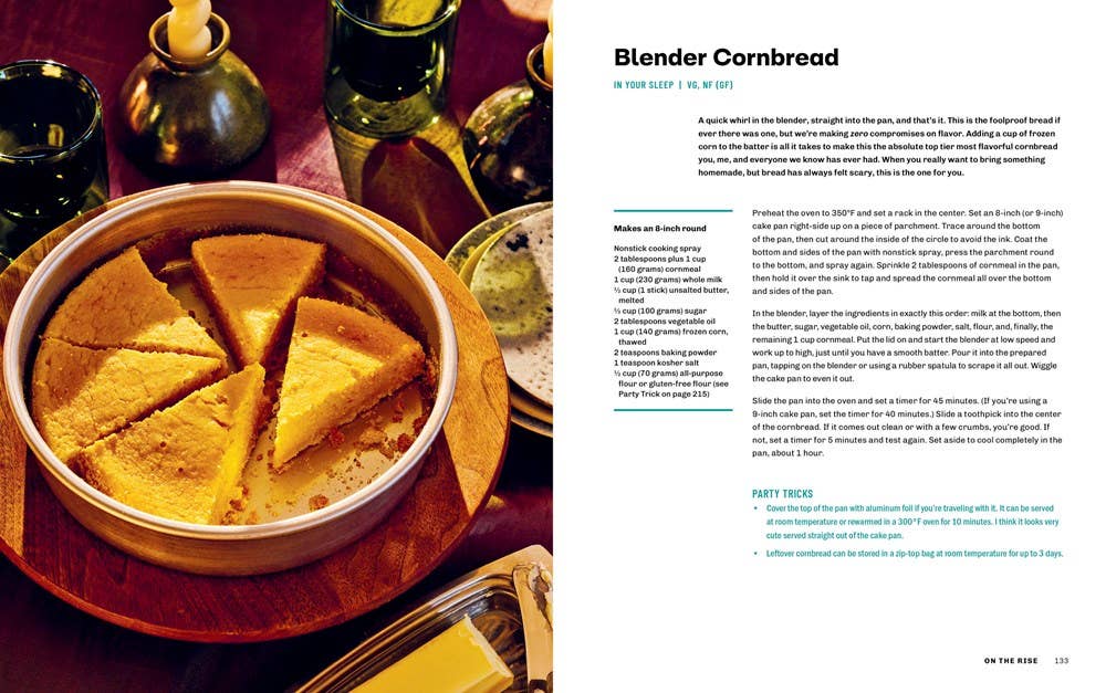 Cornbread in a dish with a side of butter on a table, next to a recipe card.