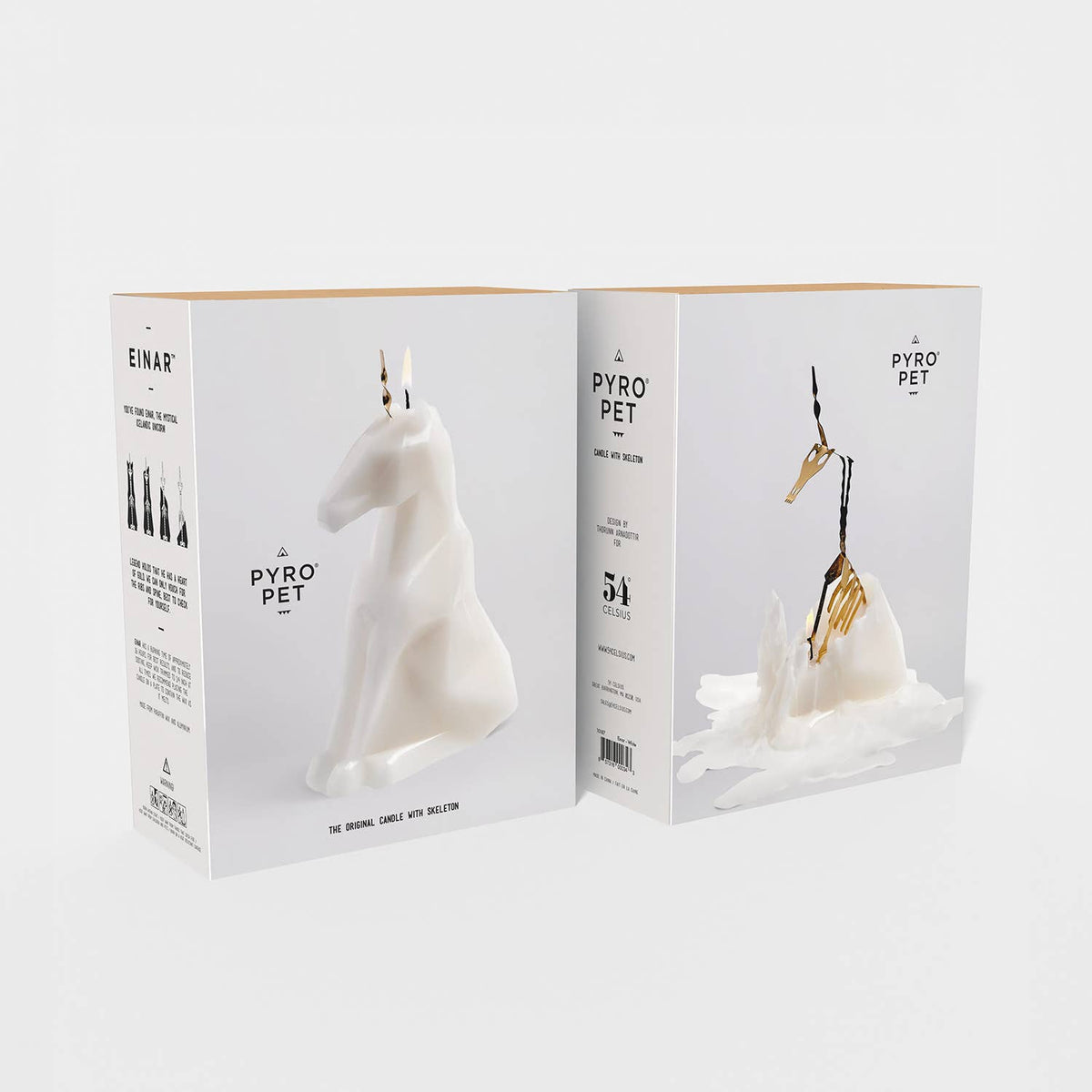 Pyro Pet product packaging with a white dog-shaped candle and gold fork on a white background