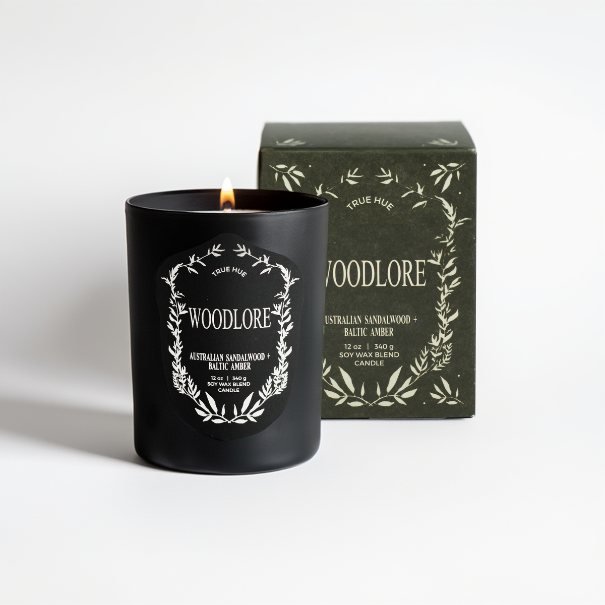 Woodlore candle with packaging on a white background