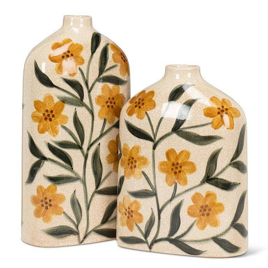 Two ceramic vases with floral patterns on a white background